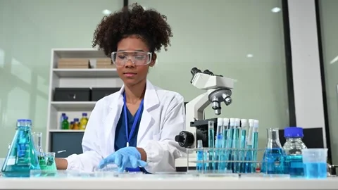 Female scientist working with micro pipettes analyzing biochemical samples,.. Stock Footage 313706113