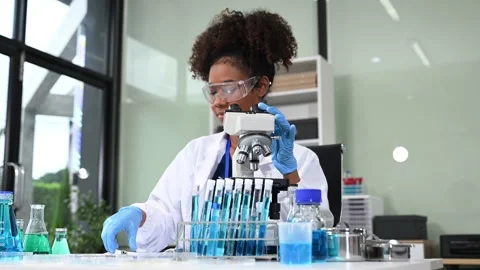 Female scientist working with micro pipettes analyzing biochemical samples,.. Stock Footage 313706124