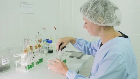 Female scientist working on tablet computer Stock Footage 78460116