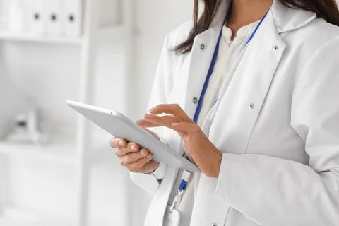 Female scientist working with tablet computer in laboratory, closeup Stock Photos