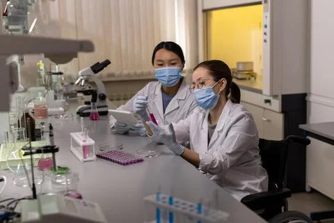 Female scientists working in the lab during pandemic Stock Photos
