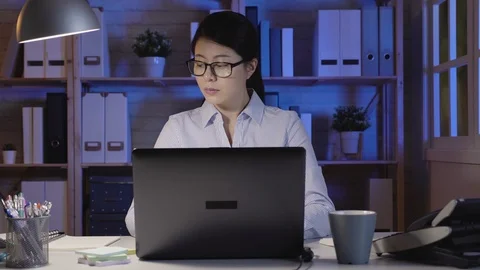 Female secretary having problems calling coworker Stock Footage 100951475