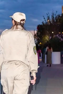 Female security guard in tan uniform standing outdoors. Russia - 28 July 2026 Stock Photos