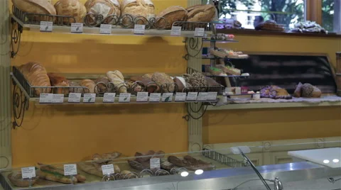 Female seller puts her hands on counter at the pastry shop Stock Footage