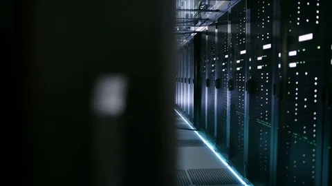 Female Server Engineer In Data Center Works on Rack Server with Her Laptop. Stock Footage 73886671