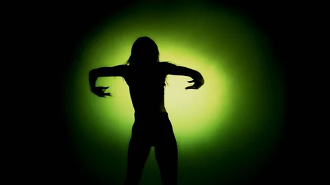 Female shadow dancer energetically danci... | Stock Video | Pond5