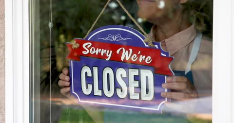 Female Shop Owner Flips Closed Sign To Open Ready for Business Stock Footage