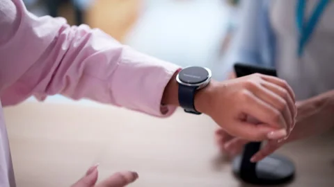 Female Shopper Using Smart Watch Wallet App To Pay Stock Footage 326162030