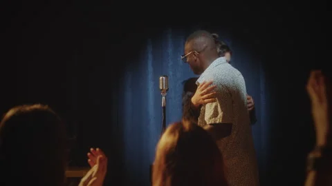 Female Show Host Introducing Comic to Audience in Stand-Up Club Stock Footage 278588700