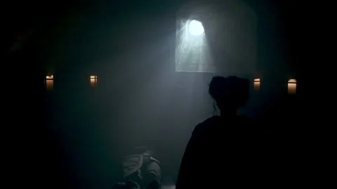 Female Silhouette Looking From Window Inside House. Silhouette of an isolated wo Video stock 294656260