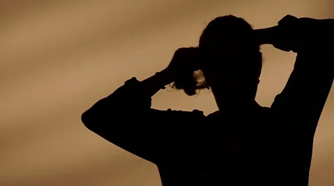 Female silhouette making a tail Stock Footage 32258386