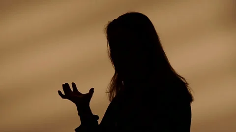 Female silhouette talking with hands Video stock 32258352