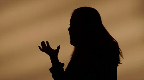 Female silhouette talking with hands Video stock 32258360