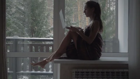 Female silhouette on the window Stock Footage 126165476