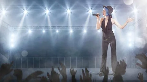 Female singer in classic style performing with lights on background Foto stock