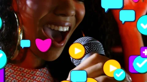 Female singer singing into hand mic, music, sparking icons floating hiding face, Stock Footage 331701530