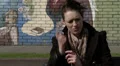 Female sitting on bench talking on phone HD Footage