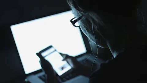 Female sitting by table in evening Stock Footage 70787724