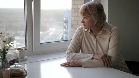 Female Sitting At Table In Kitchen Apartment And Holding Head From Migraine Ache Stock-Footage 186611219