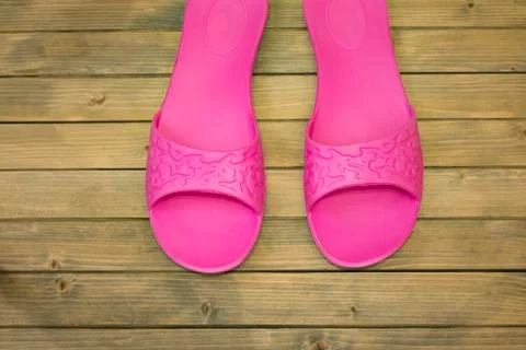 Female slippers on wooden floor or background Stock Photos