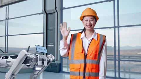 Female Smiling To Camera And Waving Hand Saying Bye In High Tech Factory Stock Footage 274537882