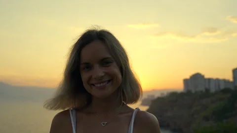 Female is smiling during sunset Stock Footage 279142001