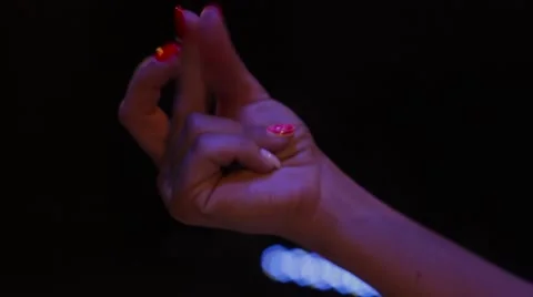 Female snapping hand  on black background Stock Footage 66385183