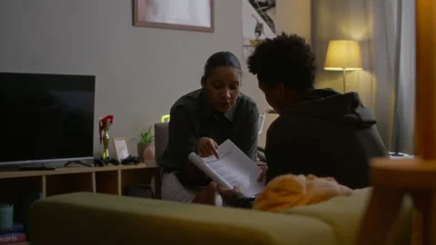 Female Social Worker Explaining to Gen Z Boy How to Apply for Assistance Program 库存影片 329682520