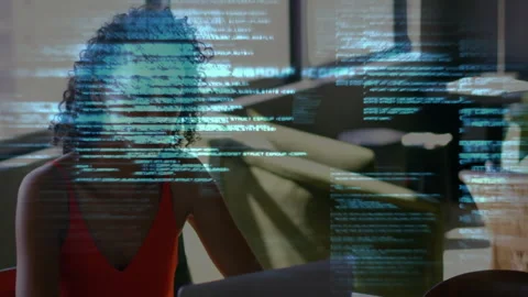 Female software developer analyzing tech code overlay at desk, blending laptop Stock Footage 307858522