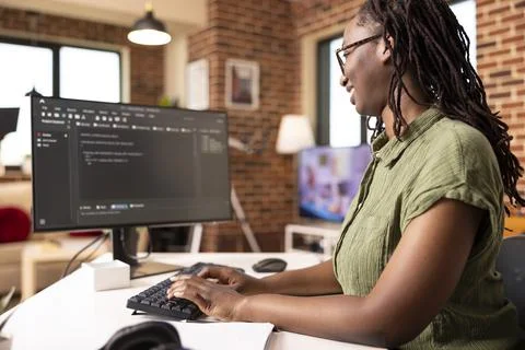 Female software developer codes securely from home office Stock Photos