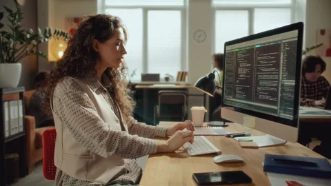 Female Software Developer Coding on Computer at Office Desk Stock Footage 305316132