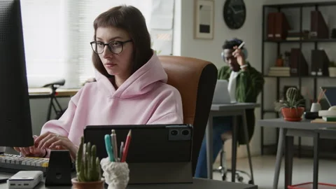 Female Software Developer Coding on Computer in Corporate Office Stock Footage 335939778