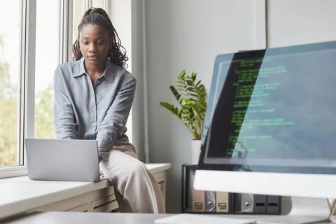 Female Software Developer in Modern Office Stock Photos
