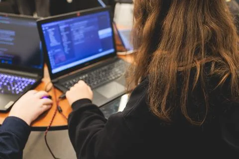 Female software developer students working on computer and laptop, programm.. Stock Photos