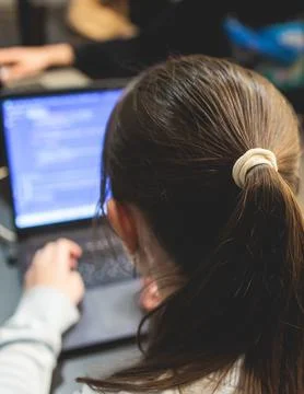 Female software developer students working on computer and laptop, programm.. Stock Photos