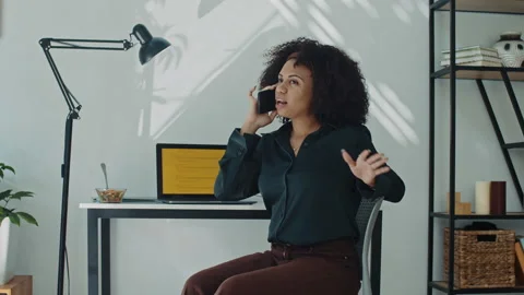 Female Software Developer Talking on Phone in Home Office Stock Footage 269019757