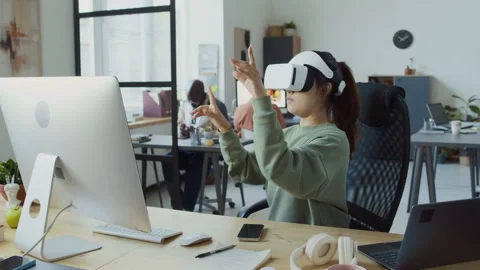 Female Software Developer Testing Mobile App in Virtual Reality Headset Stock Footage 293125073