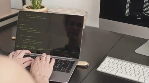 Female Software Developer Typing Program Code on Laptop Stock Footage 171533219