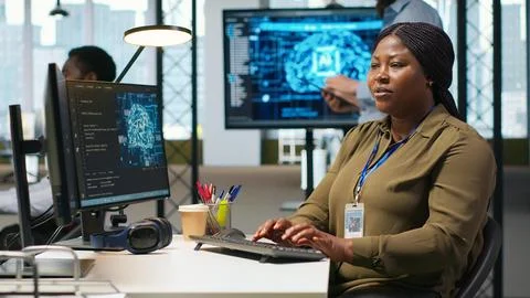 Female software developer using artificial intelligence to optimize performance Stock Photos