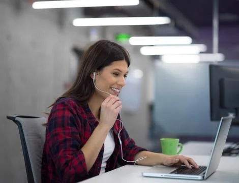 Female software developer using laptop computer 스톡 사진