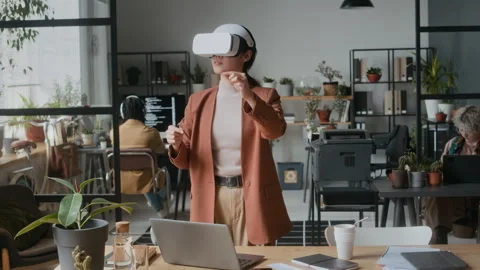 Female Software Developer Using VR Headset in Office Stock Footage 306217953