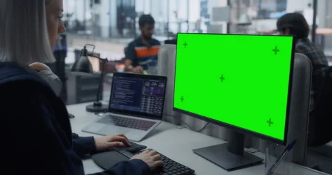 Female Software Developer Working on Computer with Green Screen Stock Footage 296183434