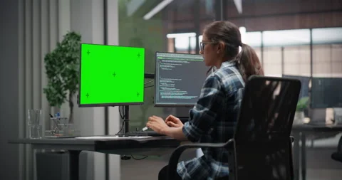 Female Software Developer Working on Computer with Green Screen Stock Footage 321012017