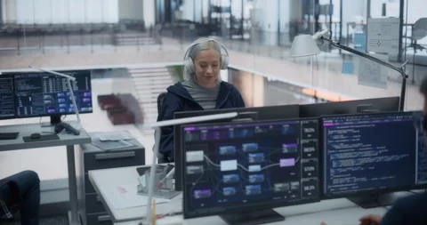 Female Software Developer Working in Office Stock Footage 296182574