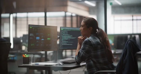 Female Software Developer Working in Office Stock Footage 321011828