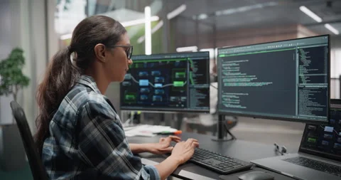 Female Software Developer Working in Office Stock Footage 321012508