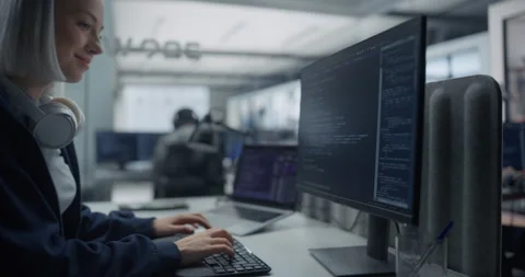 Female Software Developer Writing Code on Computer Stock Footage 296183612