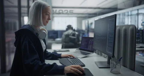 Female Software Developer Writing Code on Computer Stock Footage 296183654