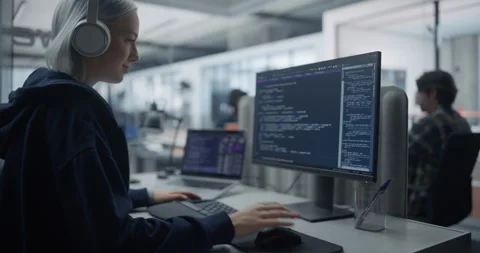 Female Software Developer Writing Code on Computer Stock Footage 296183709