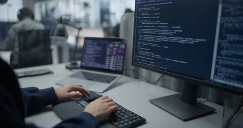 Female Software Developer Writing Code on Computer Stock Footage 296183916